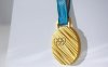 117591_2560px-Gold_medal_of_the_2018_Winter_Olympics_in_in_Pyeongchang.jpg